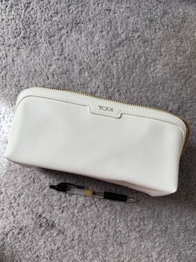Tumi White Zip toiletry/makeup bag with Gold Hardware